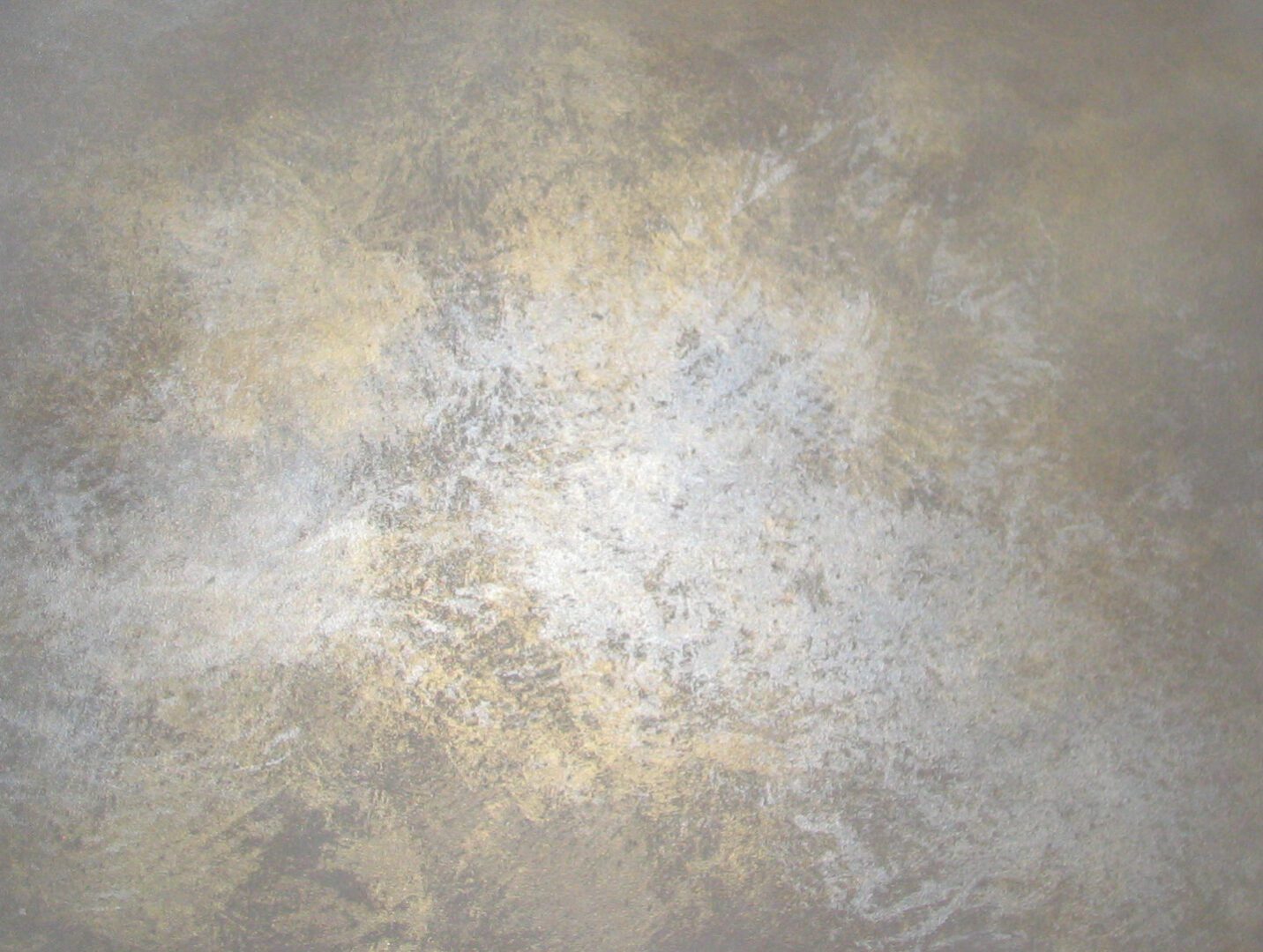 A silver background with some white spots on it