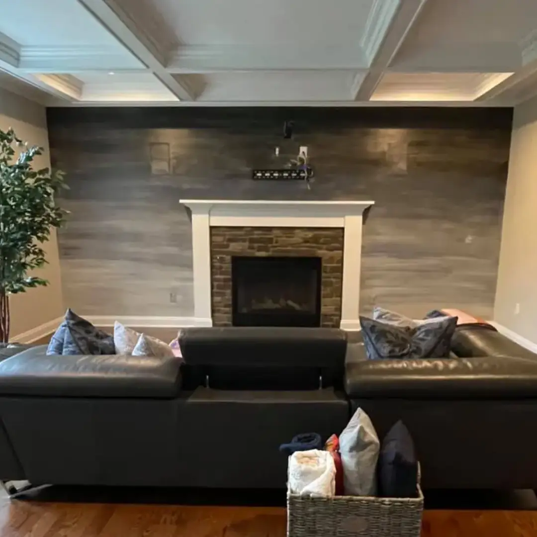 A living room with two couches and a fireplace.