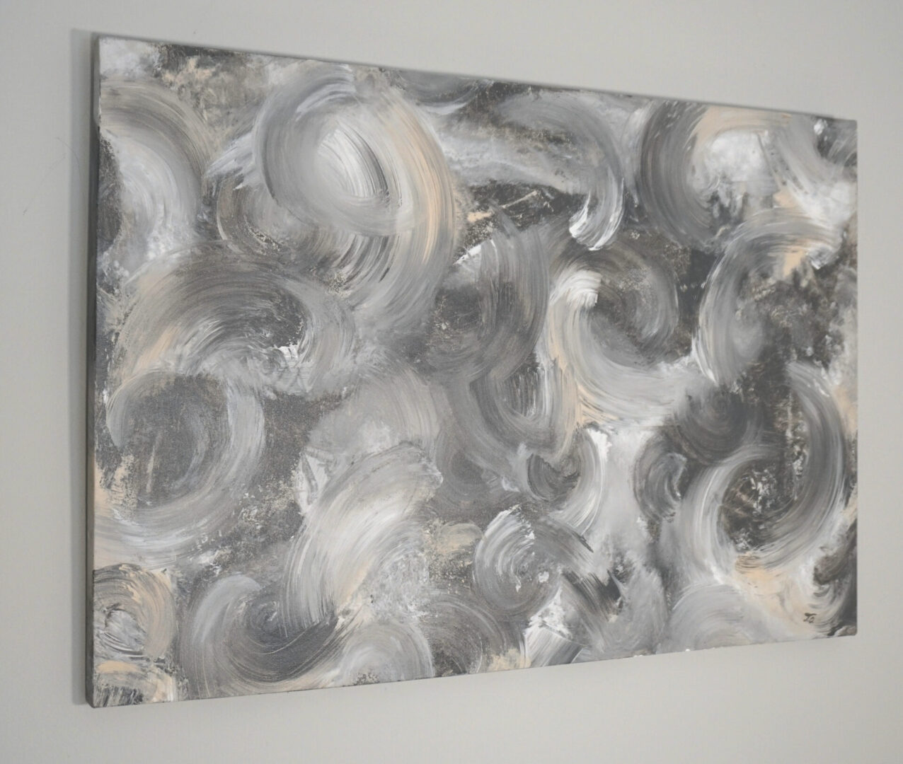 Abstract gray and beige swirl painting.